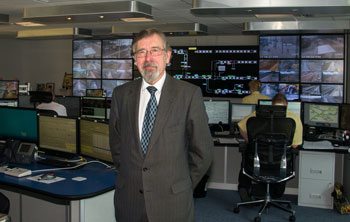 Councillor Andrew Fender, Chair of the TfGM Committee, inspects the new Metrolink control room