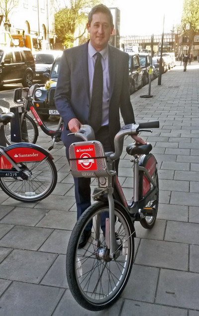 Ian Hall with Boris Bike in London