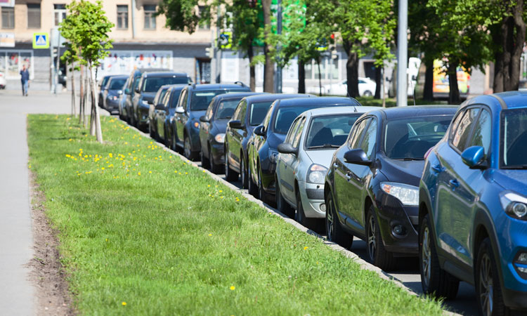 Row of parked cars demonstrate the need for better curb-side management