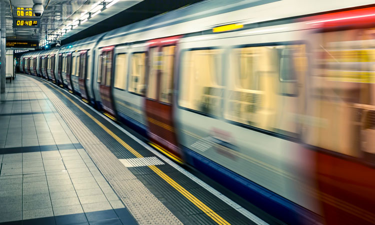 A Transport for London underground train leaves a station